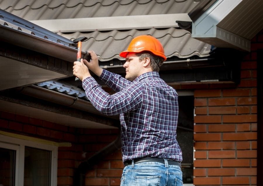 Gutter installation on residential roof